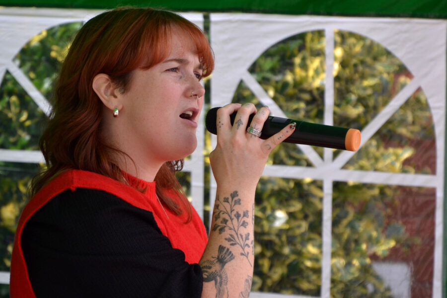 Charlotte White performing at New Street Corner on Honiton Market Charter Day 2025