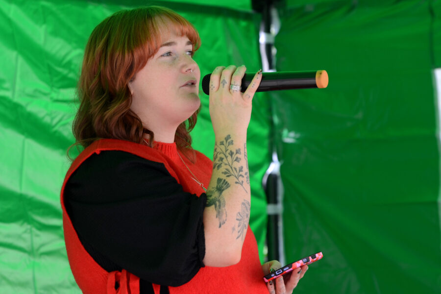 Charlotte White performing at New Street Corner on Honiton Market Charter Day 2025