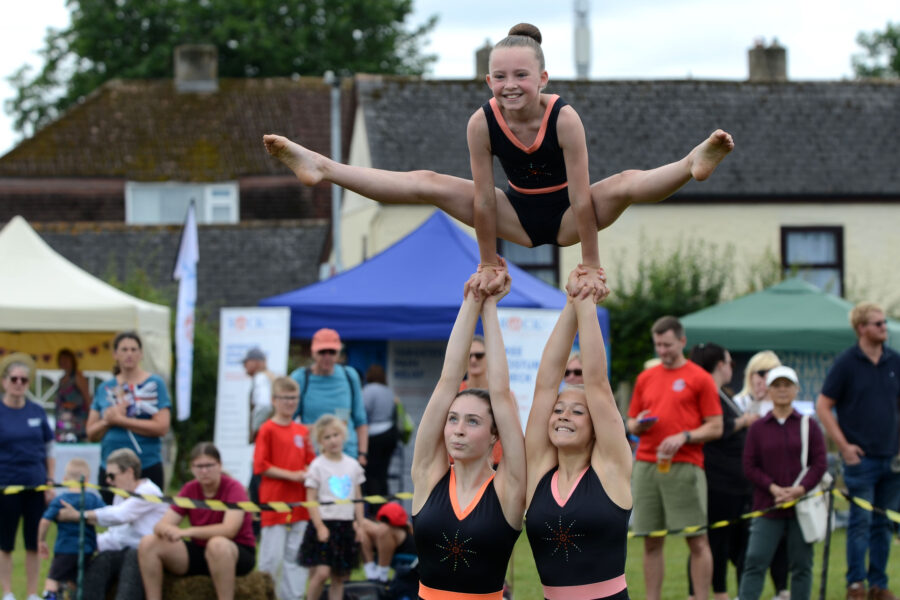 Honiton Gymnastics Club performing in the arena on Allhallows Field on Honiton Market Charter Day 2025