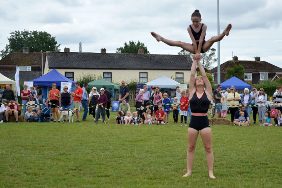 Honiton Gymnastics Club performing in the arena on Allhallows Field on Honiton Market Charter Day 2025