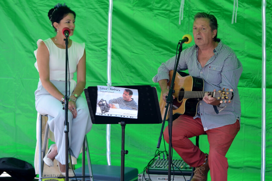 Steve Waters and Alex Oakes performing on New Street Corner at Honiton Market Charter Day 2025